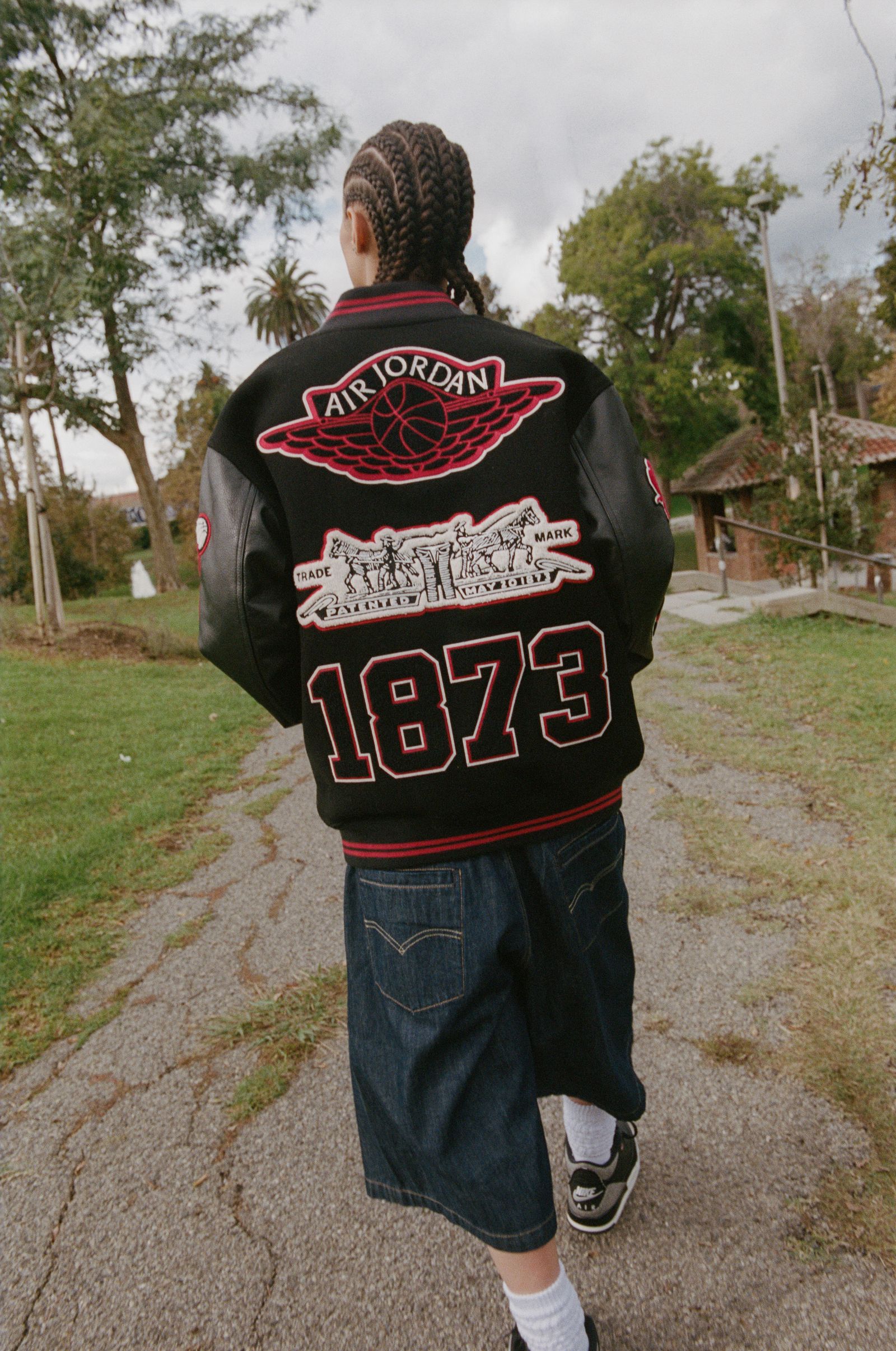 Image may contain Clothing Pants Coat Jacket Adult Person Knitwear Sweater Jeans Vest Sweatshirt and TShirt