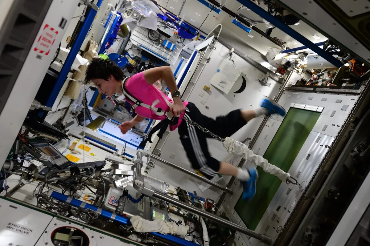 Astronauts on the ISS keep their body in shape with regular exercise. Here, harnesses keep ESA astronaut Samantha Cristoforetti's feet firmly on the treadmill in zero gravity. Credit: ESA/NASA