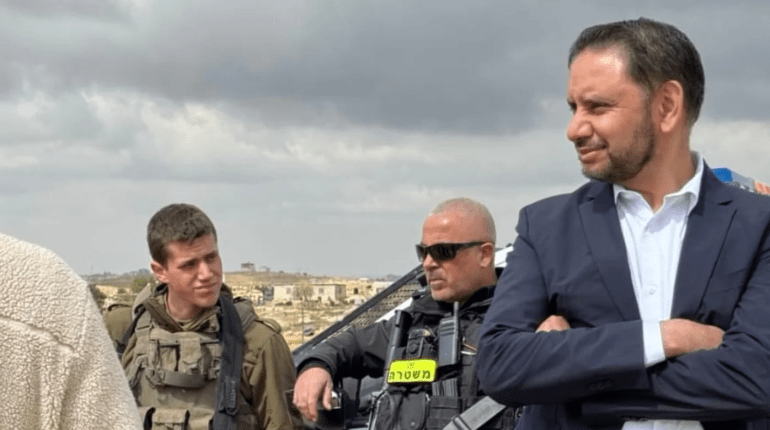 The author in Masafer Yatta, occupied west Bank, while being confronted by Israeli soldiers and armed settlers [Courtesy of Shockat Adam]