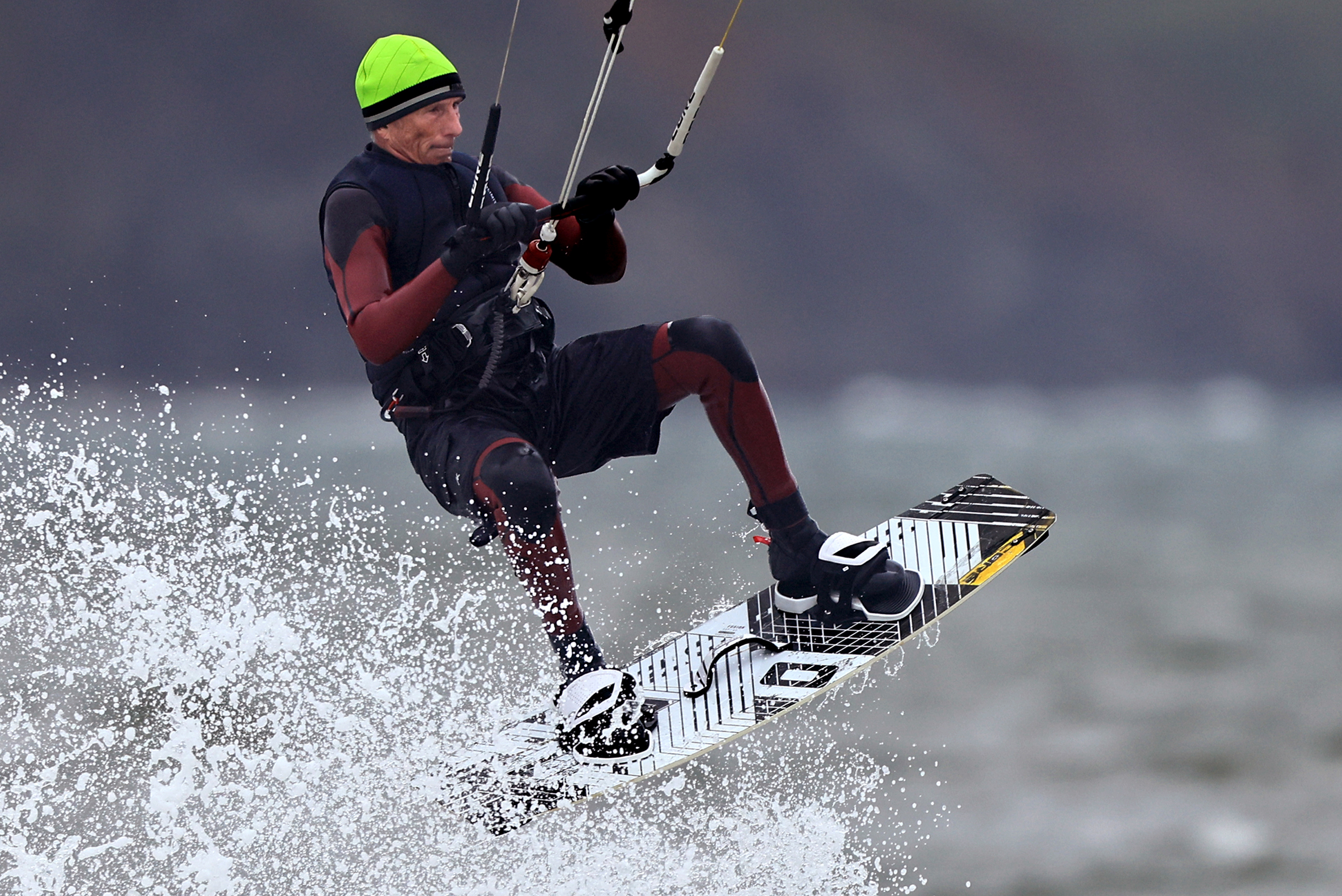 Sam Geller, 70, of Santa Rosa, kite surfs at Doran...