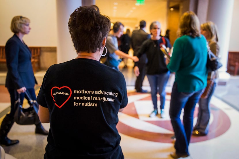 Christy Zartler, left, joins members of the Texas-based group called Mothers Advocating for...