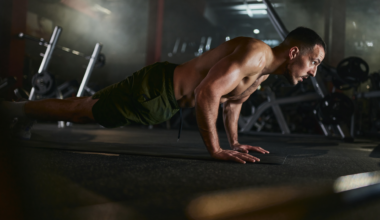 A man performing a push up in the gym