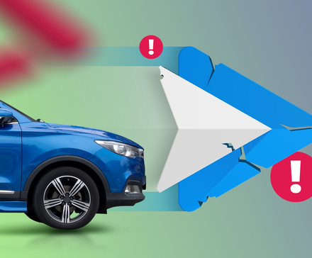 A blue car driving toward a cracked Android Auto logo, with red warning signs around it.
