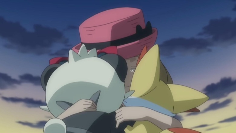 Serena crying while hugging Pancham and Fennekin in the Pokemon anime