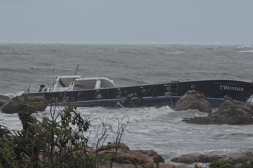 boat washed onto rocks.