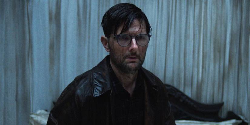 Adam Scott with blood on his face in 'Hokum'