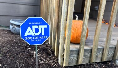 ADT sign in front yard in fall.