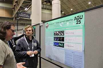 Jason Press speaking with Seaver physics professor John Mann