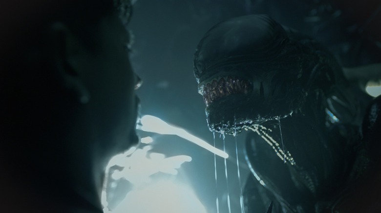 A Xenomorph bares its teeth before killing its prey in Alien: Romulus