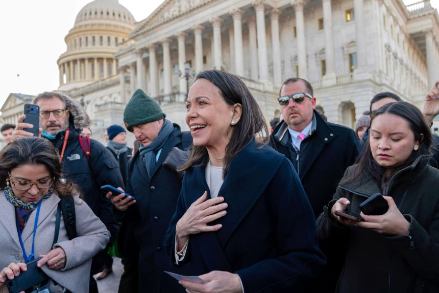 Venezuelan opposition leader María Corina Machado is swarmed by journalists and supporters as she departs the US Capitol on January 15, 2026.