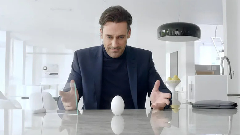 Matt looking at an egg-shaped cookie device on 