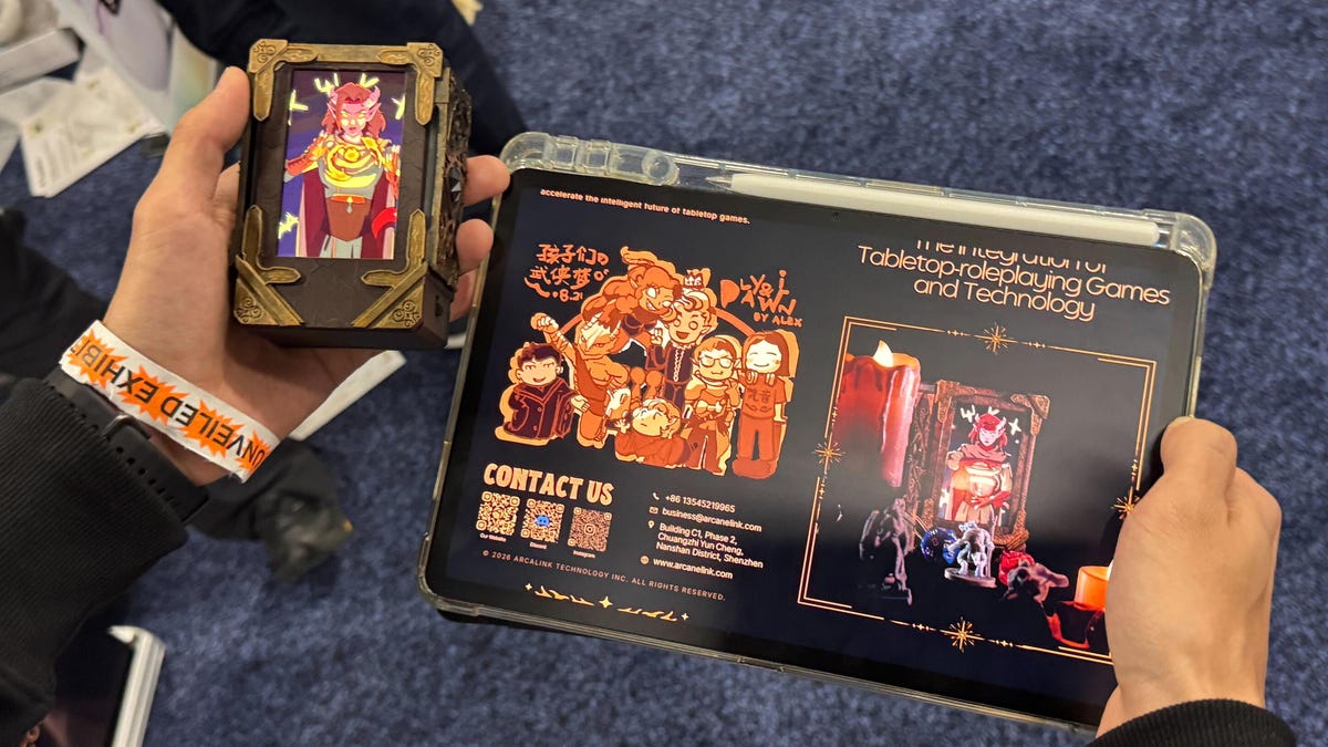 Two hands holding products: the left holds a digital screen displaying a fantasy character, while the right holds a tablet displaying game management software.