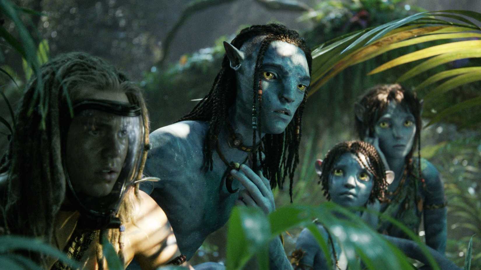 Spider, Lo'ak, Tuk, and Kiri in the forest in Avatar: Fire and Ash