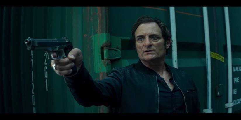 Kim Coates holding a gun in Netflix's Bad Blood