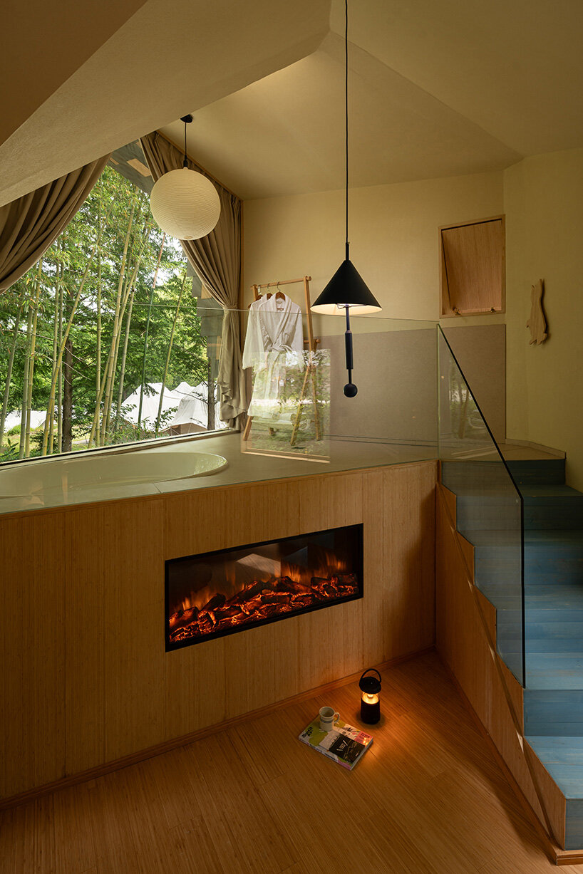 patchwork exterior of 'cat house' in china's anji forest is clad in discarded bamboo tiles