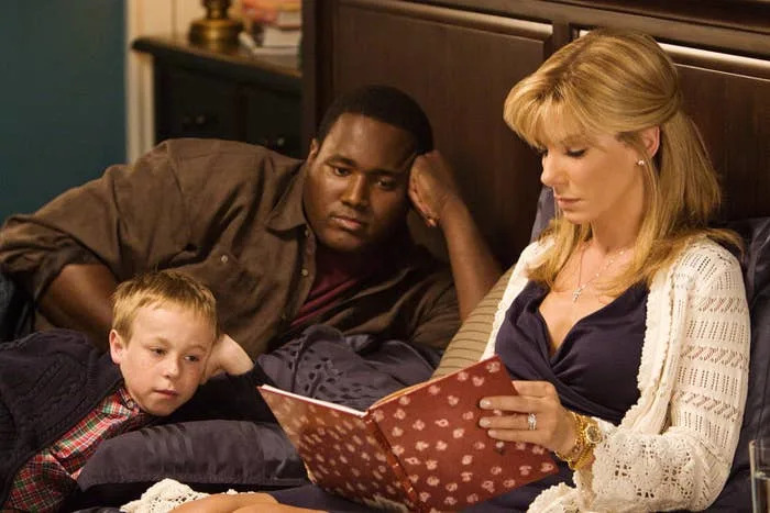Jae Head, Quinton Aaron and Sandra Bullock in "The Blind Side"