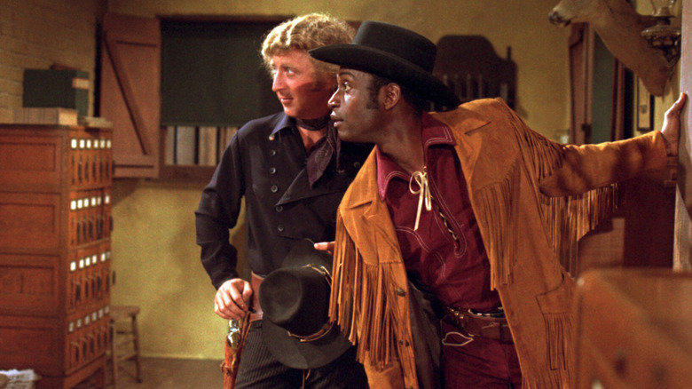 Jim the Waco Kid (Gene Wilder) and Bart (Cleavon Little) look off-camera in Blazing Saddles