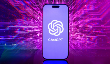 A ChatGPT logo on a phone, against a neon pink background.