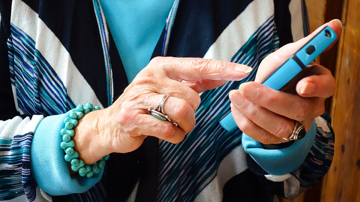 Woman typing on her smartphone.