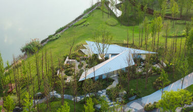 folded triangular roof planes shape café along china's yangtze river