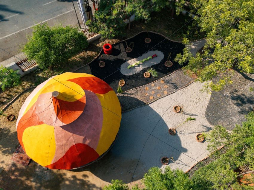 reclaimed materials sculpt textured children’s play structures in india public park