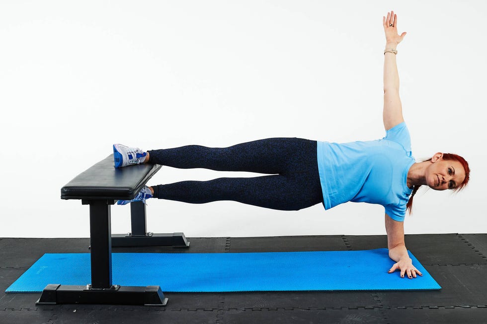 a person performing a workout on a bench