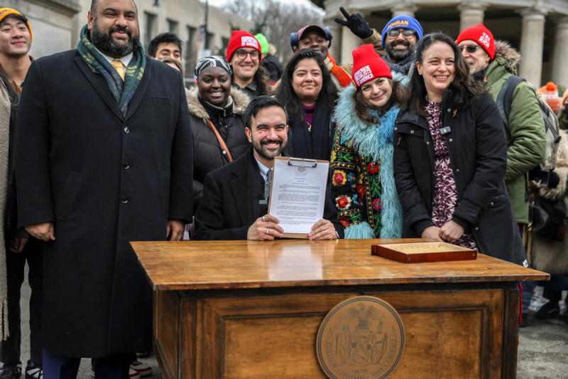 Zohran Mamdani holds a signed executive order
