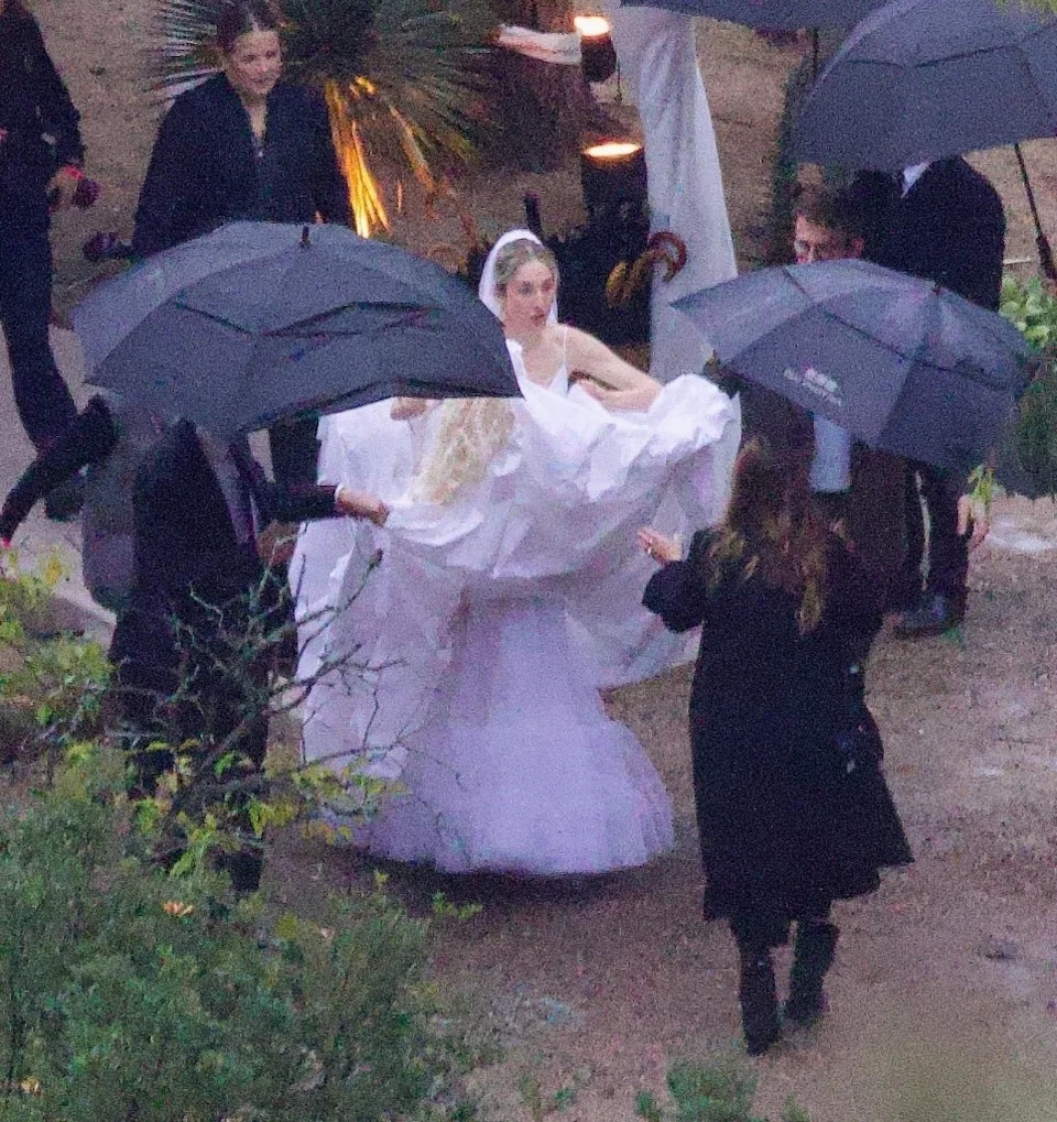 Haim was spotted in her Louis Vuitton wedding dress. BACKGRID