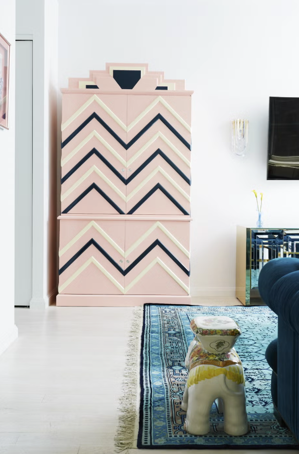 Stylish storage cabinet with zigzag patterns in a modern living space.
