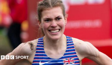 Megan Keith with mud on her shoulder after winning the European Under-23 Cross Country title in 2023