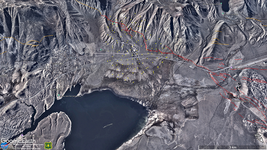A colorful three-dimensional map of mountains and a lake overlaid with red and orange lines and yellow dots