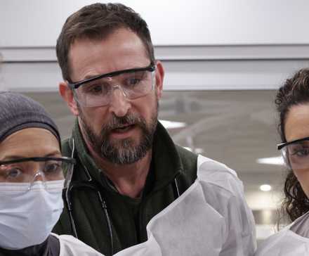 Dr. Robby and his team in The Pitt season 2 seeming started as they look over a patient.