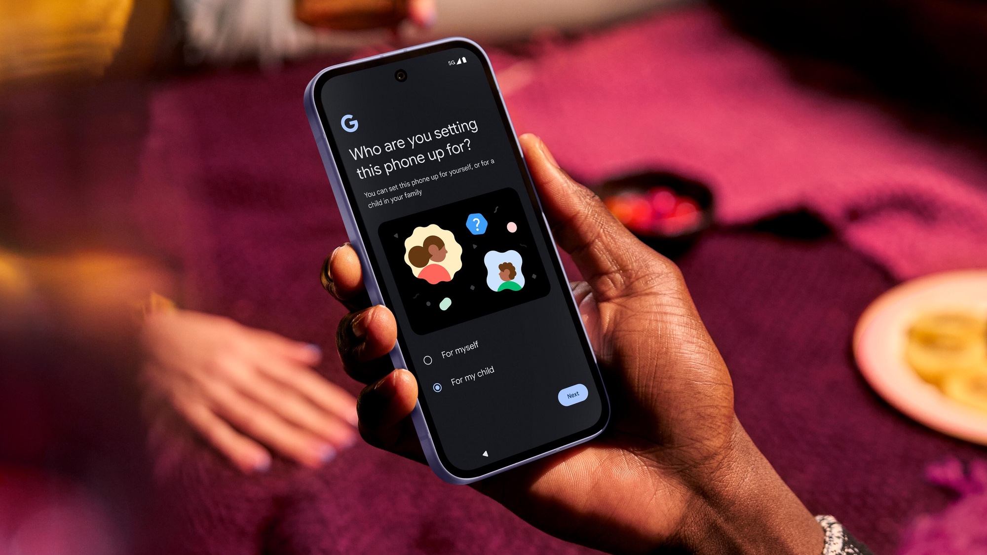 Google Pixel 9a held in hand showing the software