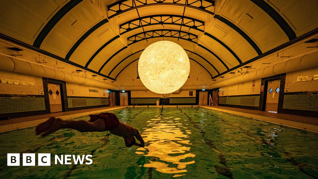 Luke Jerram's sun-inspired sculpture on display at Bristol pool