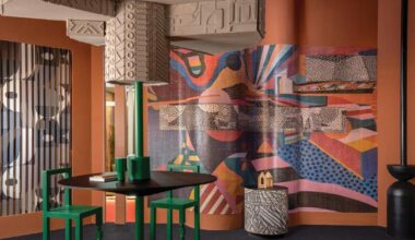 patterned tiles extend from curved walls to furniture in layered retail exhibition booth