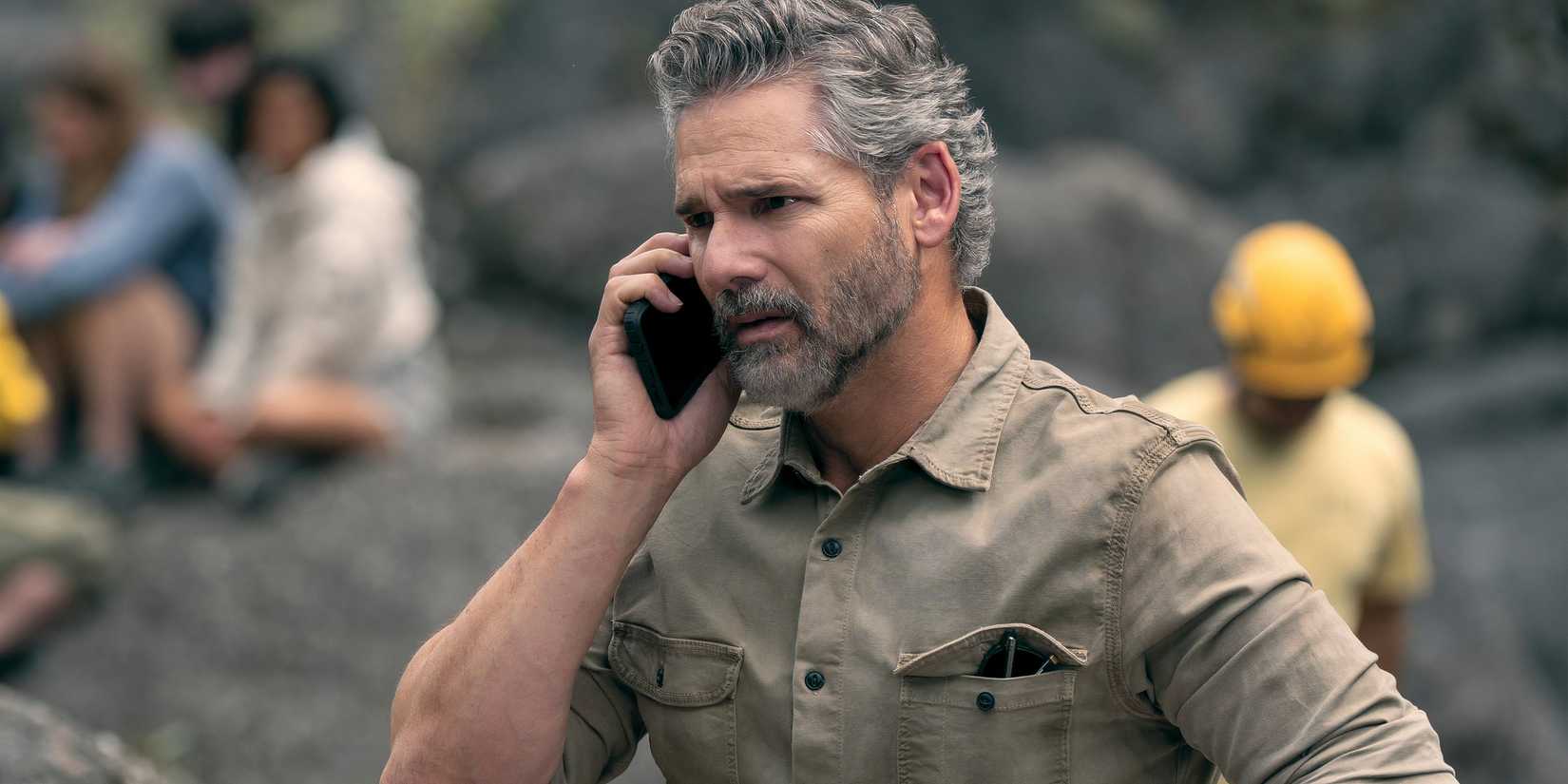 Eric Bana as Kyle Turner on the phone and looking concerned in Netflix's Untamed