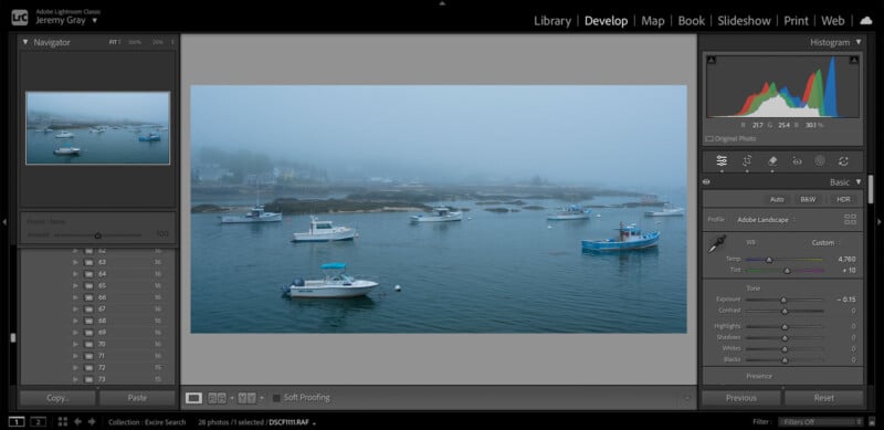 Screenshot of Adobe Lightroom showing a photo of boats anchored on calm water under a foggy sky. The editing interface displays adjustment sliders and a histogram on the right side of the screen.