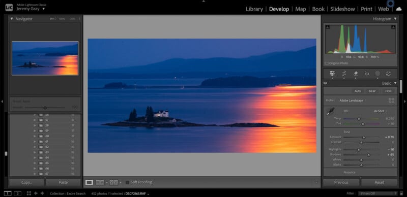 A Lightroom editing workspace shows a photo of a small island with a lighthouse at dusk, surrounded by calm water reflecting a vivid orange sunset. Editing sliders and a histogram appear on the right side of the screen.