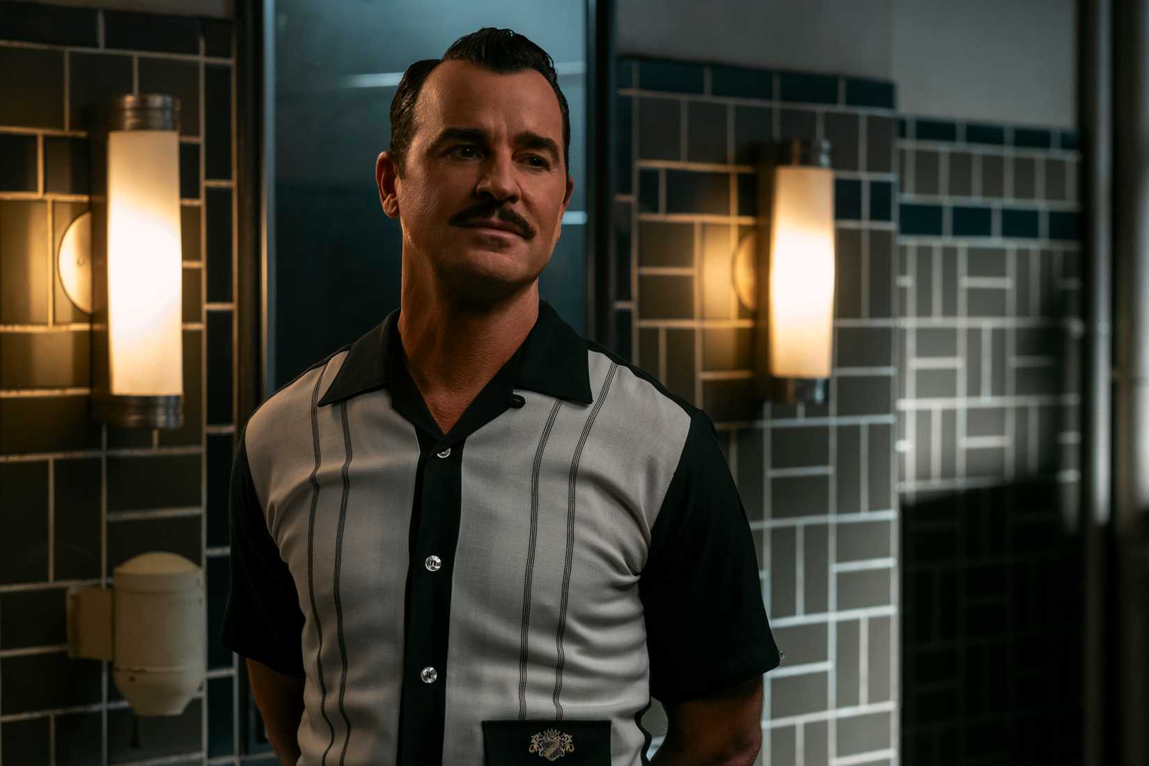Mr. House (Justin Theroux) approaches Cooper Howard in a public restroom without revealing his identity on Fallout.