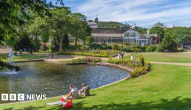 A large wide shot of the Somerset Levels with Glastonbury Tor in the centre and fields surrounding it