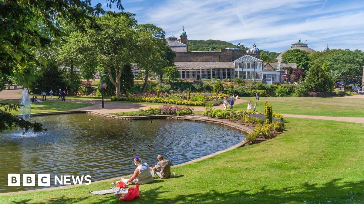 A large wide shot of the Somerset Levels with Glastonbury Tor in the centre and fields surrounding it