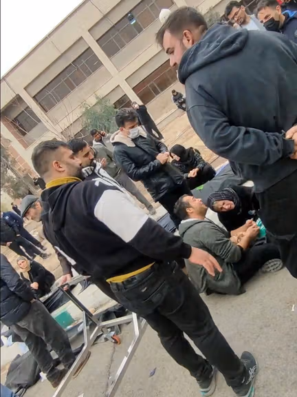 Families mourn as they gather at a facility to collect the bodies of loved ones killed during protests. (January 2026)