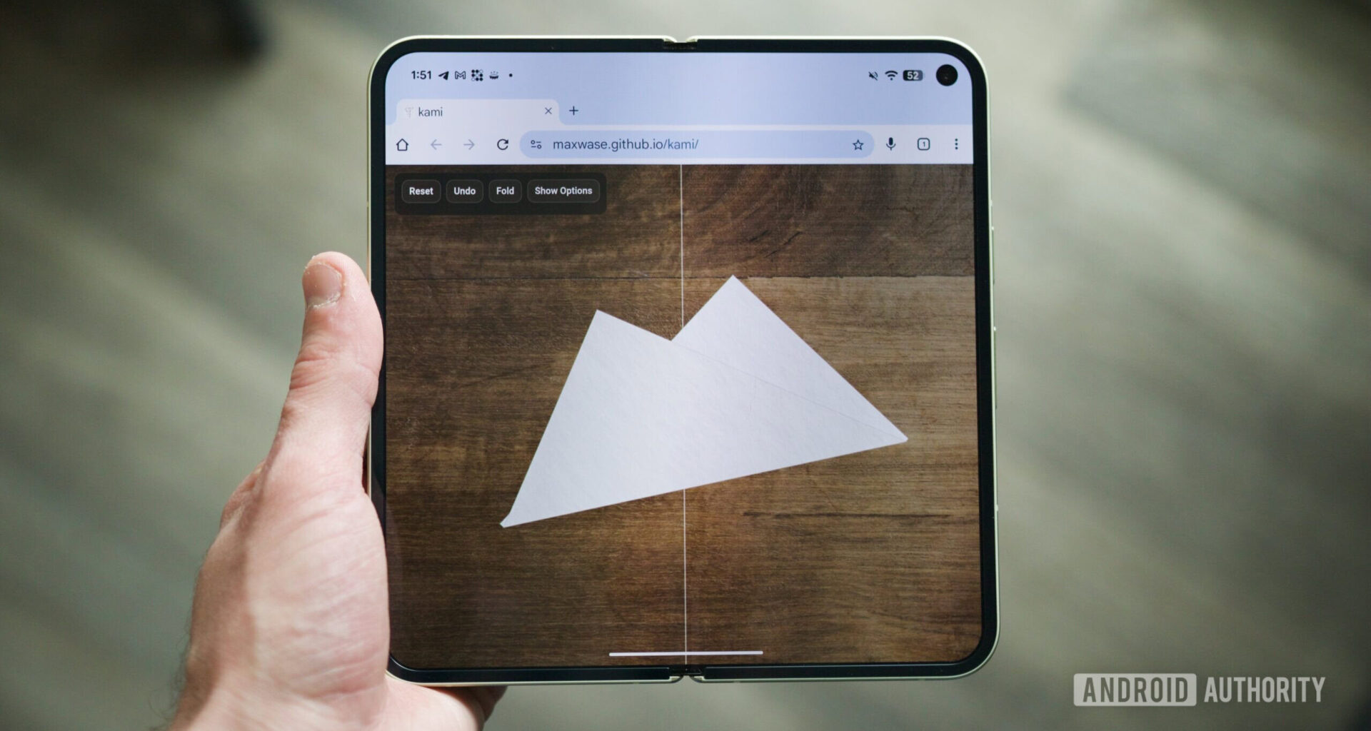 Origami website running on a foldable phone.