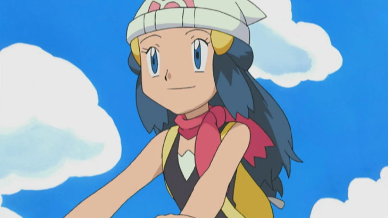Dawn riding her bike and smiling in the Pokemon anime