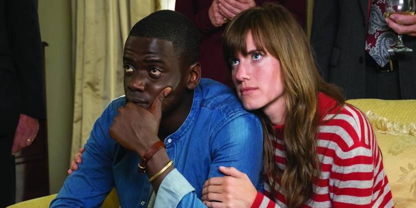 Daniel Kaluuya and Allison Williams looking in the same direction in Get Out