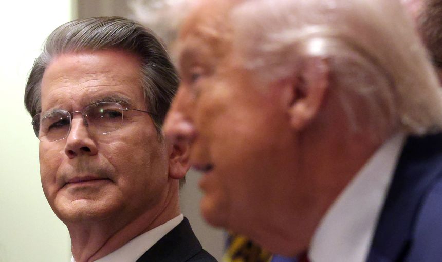 Bessent looks on as Trump delivers remarks during a roundtable discussion in the White House on December 8, 2025 in Washington, DC.