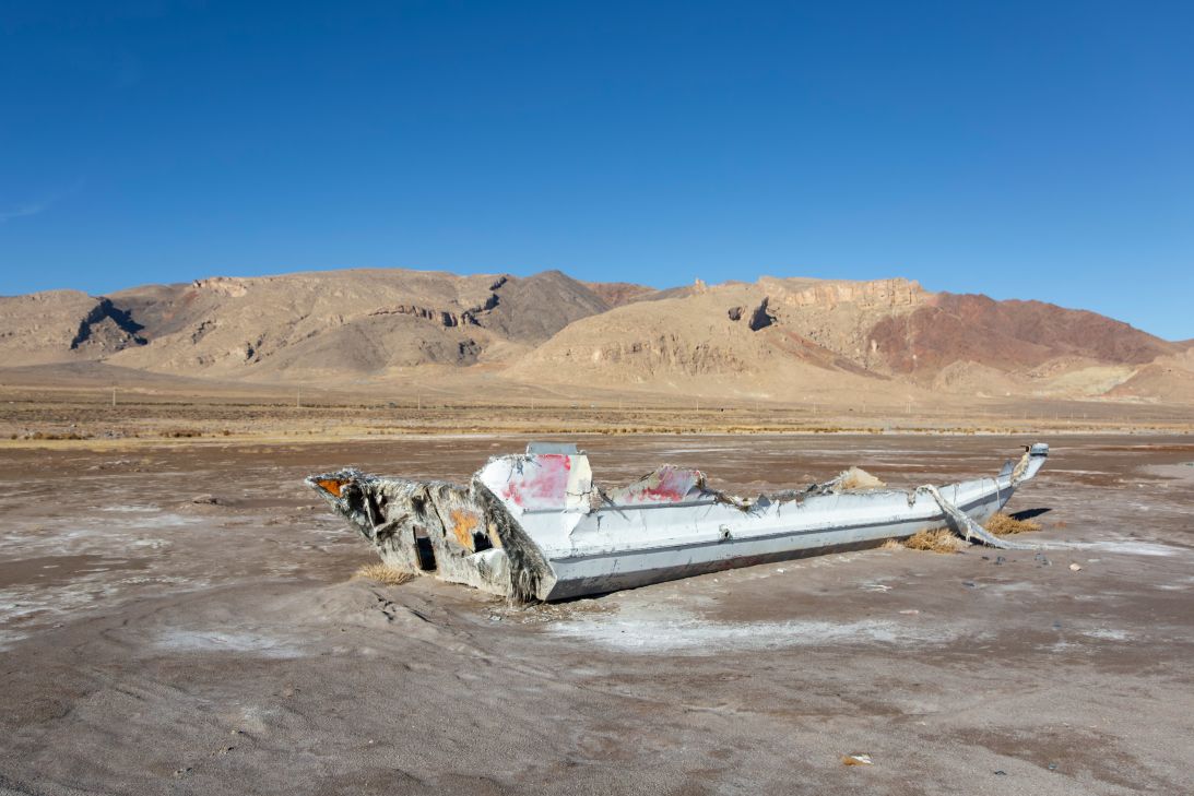 Remnants of a boat sit on the dry bed of Lake Urmia in northwestern Iran on December 19, 2025. The lake has shrunk due to drought, river damming and extensive groundwater extraction.