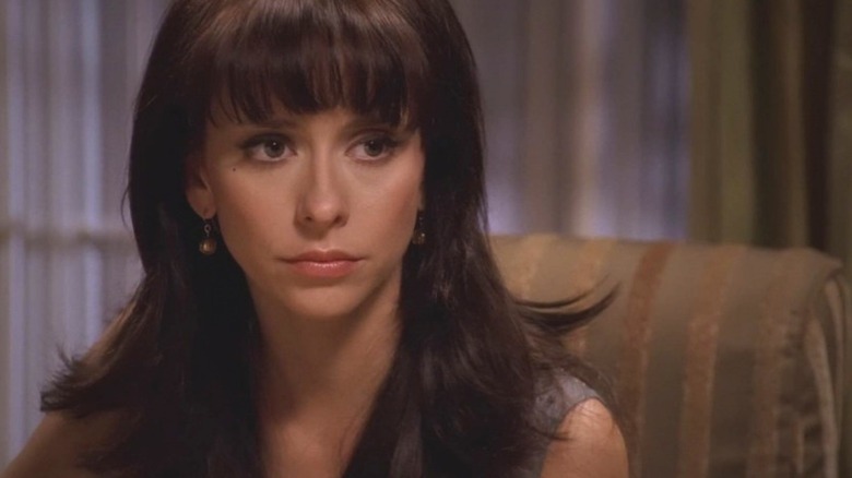 Melinda in bangs, seated