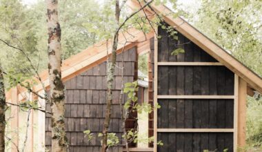 fireplace shelter made from reclaimed materials stands in northern norway