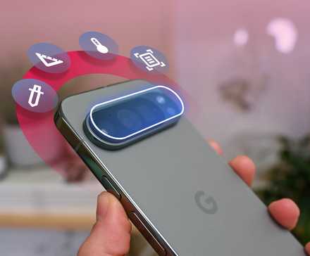 Close-up shot of handing holding Google Pixel phone with animated icons surrounding the camera